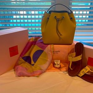Katespade drawstring bucket bag in canary yellow with beige trim and gold ware.